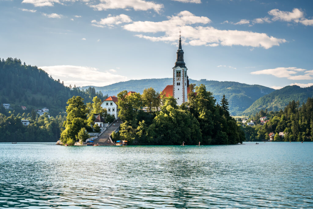 scenic-view-building-by-trees-lake-by-mountains-against-sky-1024x683 Mystical Bled: Discover the enchanting legends of Slovenia's famous island