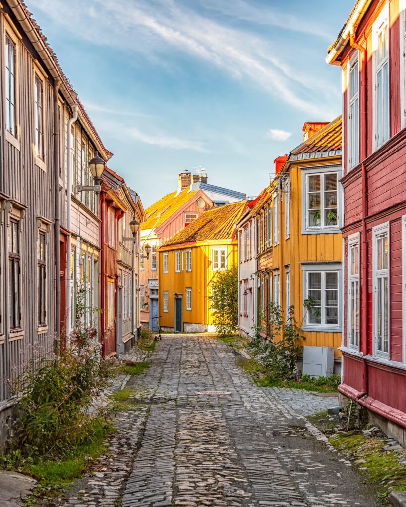 vertical-shot-colorful-buildings-old-street-trondheim-norway-819x1024 The mythical guardian of Nidaros: The enchanted dragon of Trondheim's famous cathedral